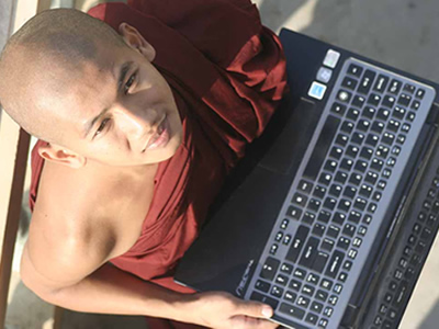 monk-laptop-mandalay-myanmar-globalonly-foundation